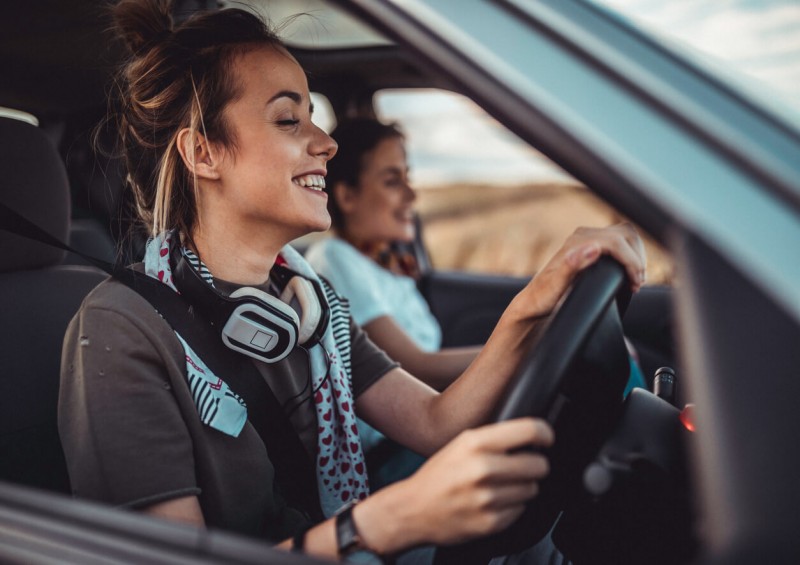 Young women driving car