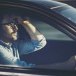 A man driving while concerned about unemployment