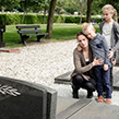 Children and mum visiting grave of their father