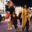 Family of four shopping at Christmas time