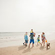 Family walking along the beach
