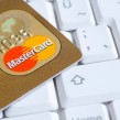 Gold MasterCard on computer keyboard