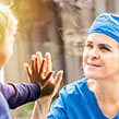 Healthcare NHS worker with child through window