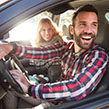 Man driving with woman passenger