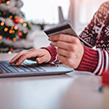 Person Christmas shopping with credit card