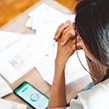 Woman distressed looking at credit score