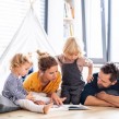 Young family reading a book